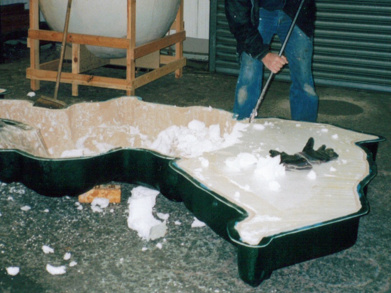 Photo - One of the Illuminations staff digging out the polystyrene and plaster - Moulding and Casting - Making of a Blackpool Illumination - © Sarah Myerscough