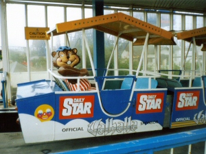 Photo - Seated in the last carriage of the open air Monorail within the station