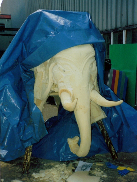 Photo - Too big for the workshop, a waterproof sheet protects the work in progress from the Blackpool weather - Dali Style Elephant - Blackpool Pleasure Beach Gallery - © Sarah Myerscough