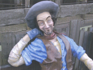 Photo - Detail of one of the prospectors on a bench outside the Gold Mine ride