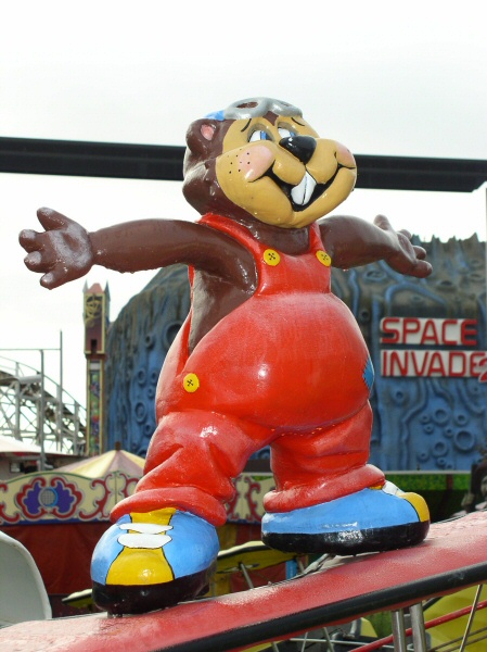 Photo - Close-up of character fitted to the ride with the Space Invader ride behind it - Wing Walker (Helicoptor Ride) - Blackpool Pleasure Beach Gallery - © Sarah Myerscough