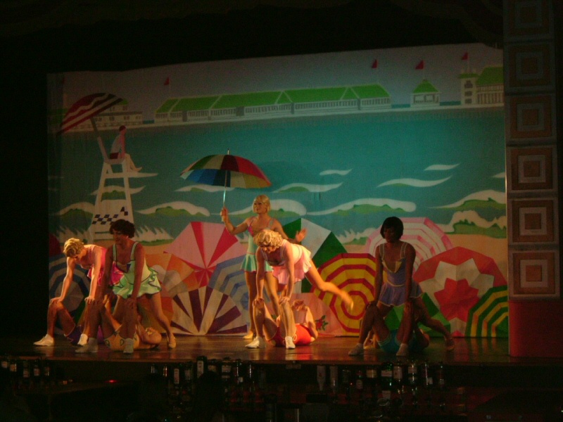 Photo - Beachwear frolics in front of painted beach scene backdrop - Funny Girls 2006 - Misc Works Gallery - © Sarah Myerscough