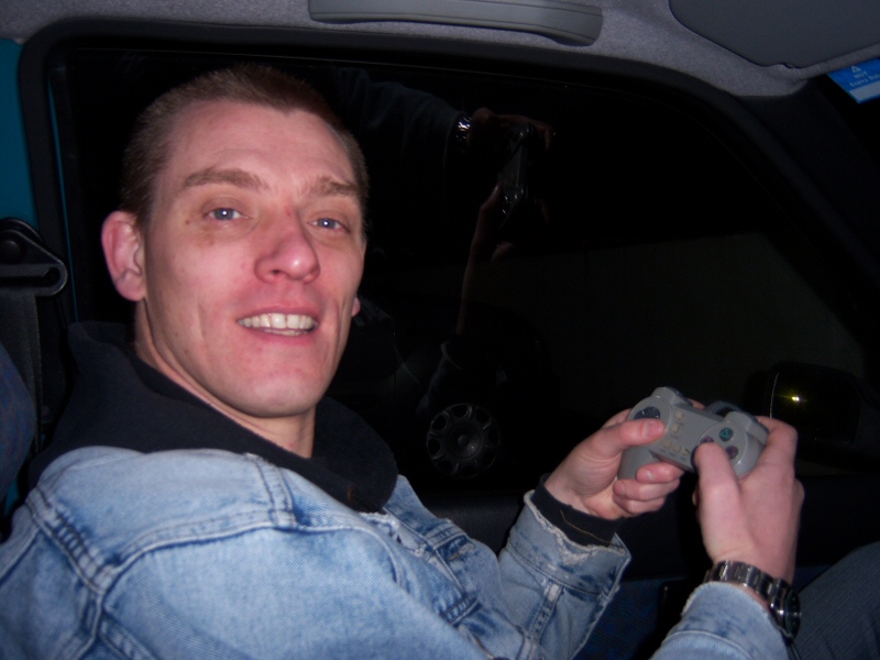 Photo - Husband Dave sat in the car passing the time on a portable Playstation - Grand Theatre Slides 2008 - Blackpool Illuminations Gallery - © Sarah Myerscough